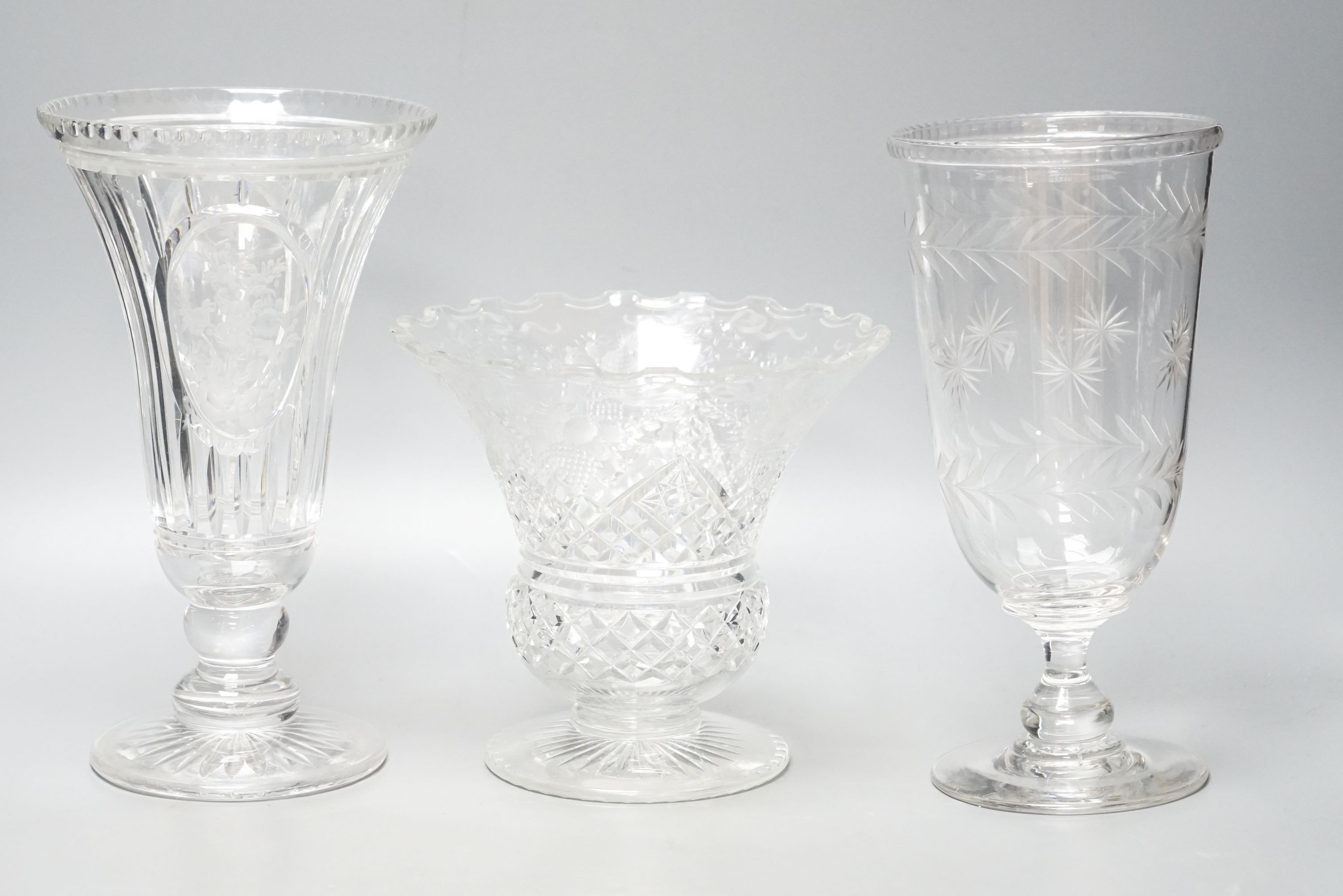 Three early 20th century cut and engraved glass vases 25cm